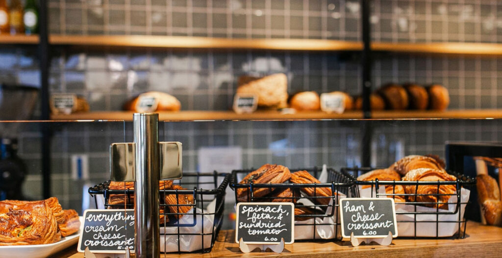 Freshly baked savory croissants and pastries on the LeRouge Boulangerie careers application page.
