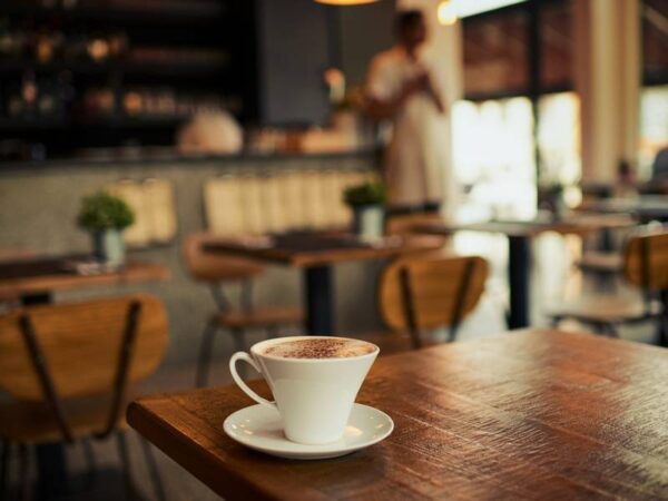 A cup of cappuccino with cocoa powder at Le Rouge Bakery.